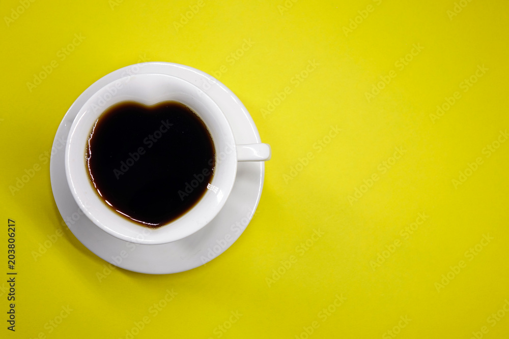 coffee on a colored background top view, white Cup in the shape of a heart coffee on a colored background top view, white Cup in the shape of a heart