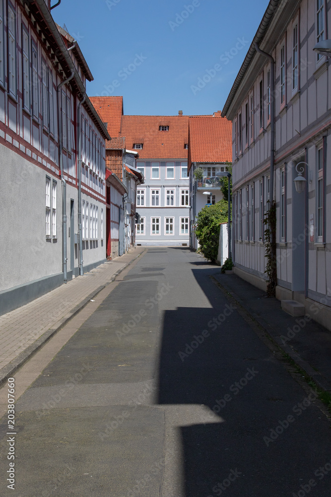 View into a little street with frame work houses in a city in germany on a sunny day