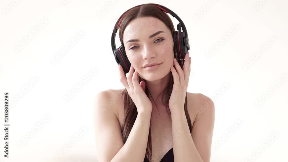 Portrait of a woman with big headphones with music Portrait of a woman with big headphones with music