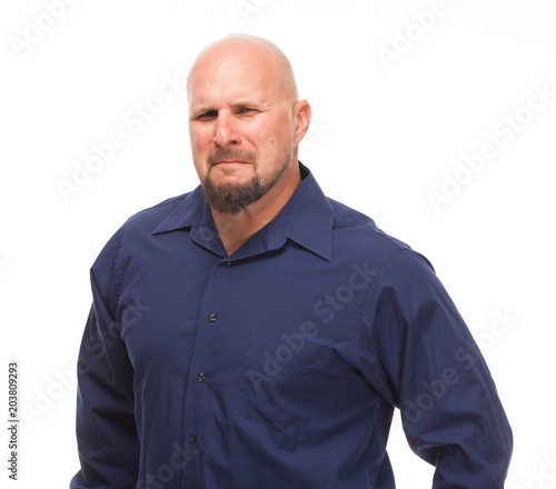 Man on white background with sour expression.