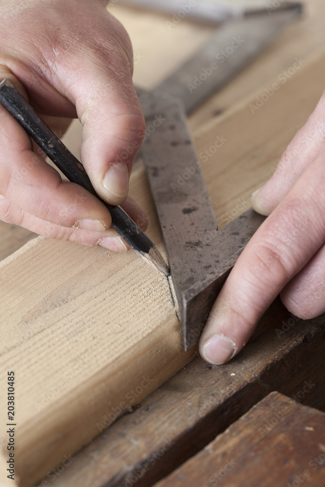 carpenter drawing on a wooden board.copy space carpenter drawing on a wooden board.copy space