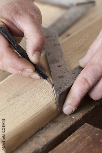 carpenter drawing on a wooden board.copy space