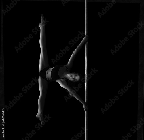 Young slim sexy pole dance woman