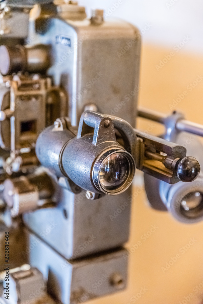 Old movie cinema film projector of 8mm and 16mm show old long lens .Vintage retro technology concept Old movie cinema film projector of 8mm and 16mm show old long lens .Vintage retro technology concept