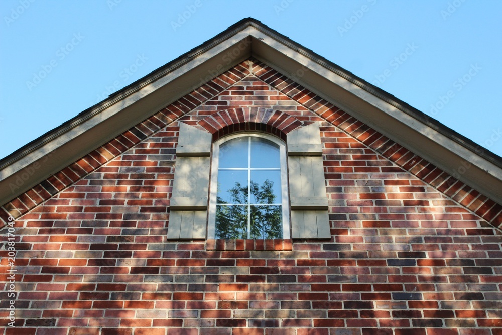 Brick house with window and shutters 