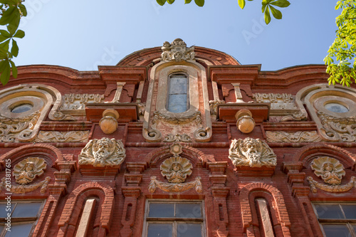 Volgograd. Russia - May 6, 2018. The facade of the 4th female gymnasium  in 1862; restored in 1949-1950, architects Rossikhin GA, Kubikov VA .. Volgograd Music and Dramatic Cossack Theater. photo