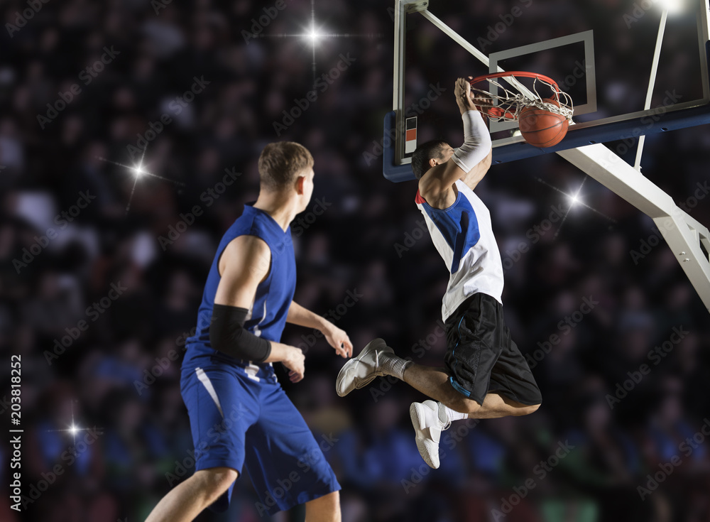 Fototapeta premium Two basketball players in action