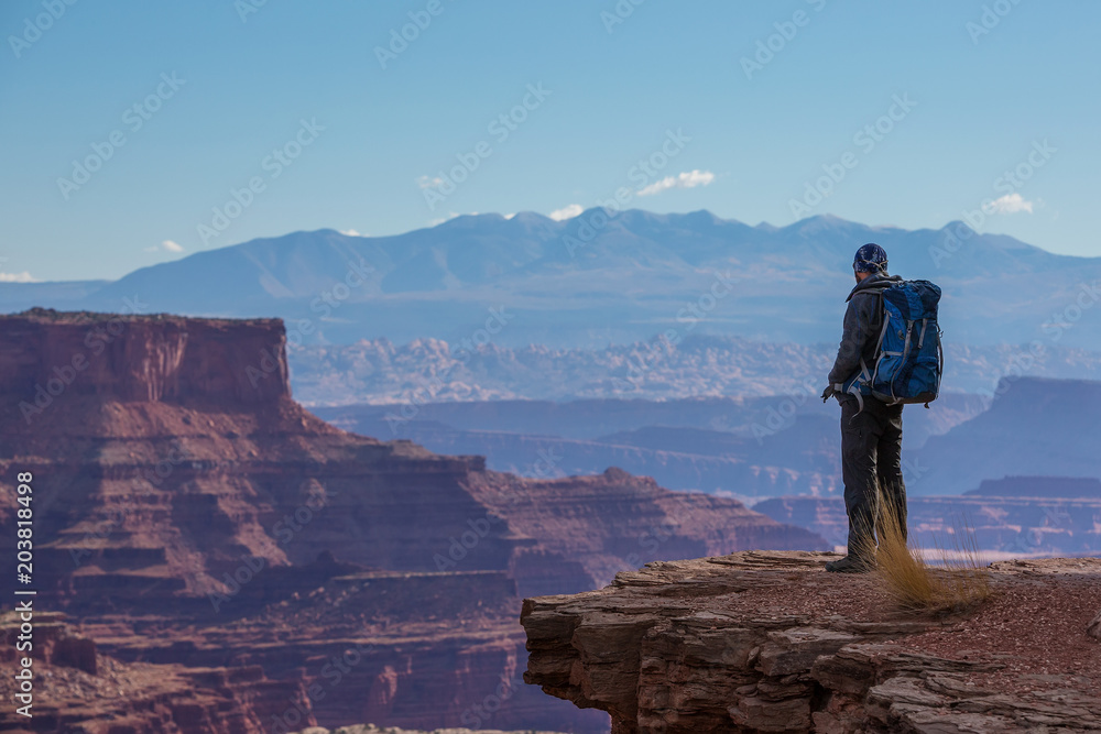 Obraz premium Hiker in Canyonlands National park in Utah, USA