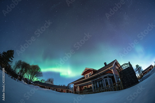 north light aurora on night sky at swedish countryside, north of country, village