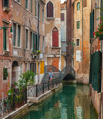 Narrow canal with restauran...