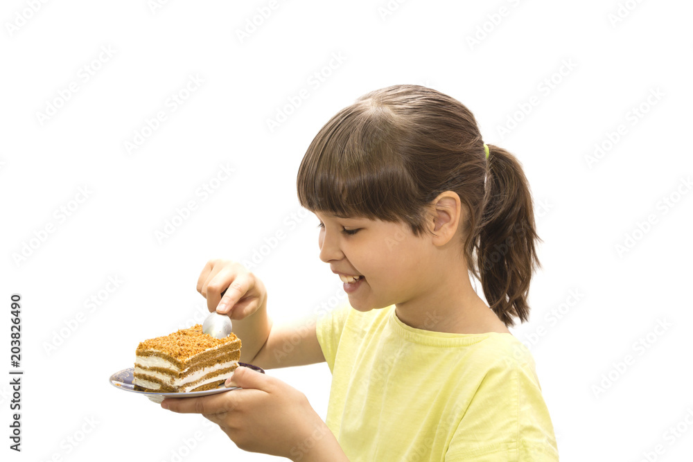 Girl eating cake. Isolated on white background. Girl eating cake. Isolated on white background.