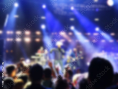 Blurred abstract background. Bokeh lighting in concert with audience.