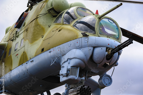 Obraz na płótnie Low angle view to gun, cockpits and part of the fuselage of a Mil Mi-24 (NATO reporting name: Hind) military attack helicopter
