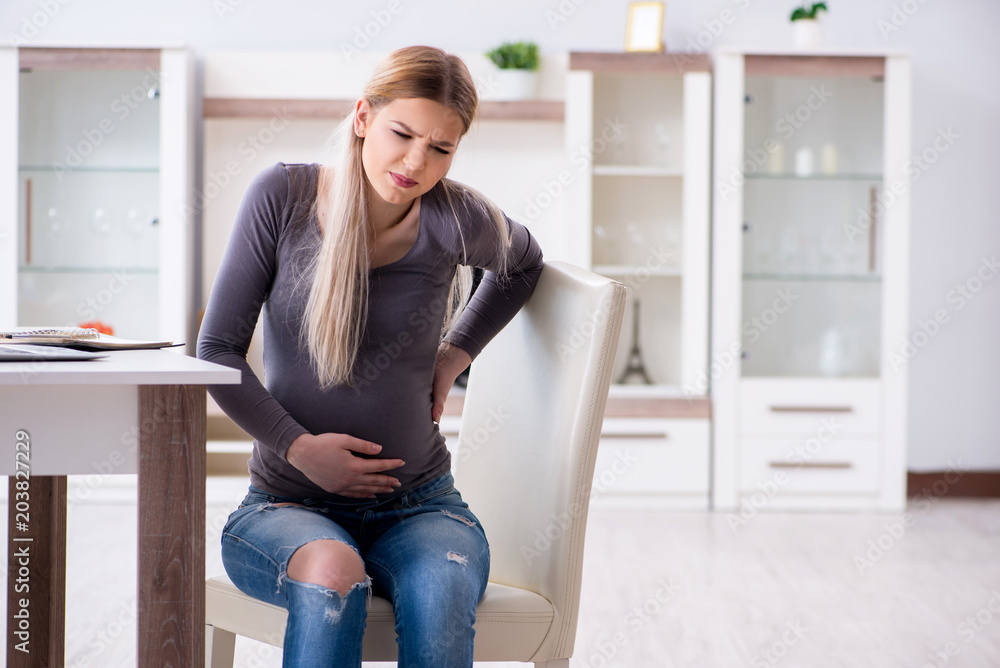 Pregnant woman at home getting ready for childbirth Pregnant woman at home getting ready for childbirth