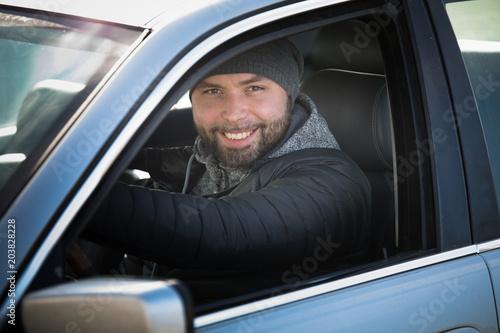 Portrait of man in his car.