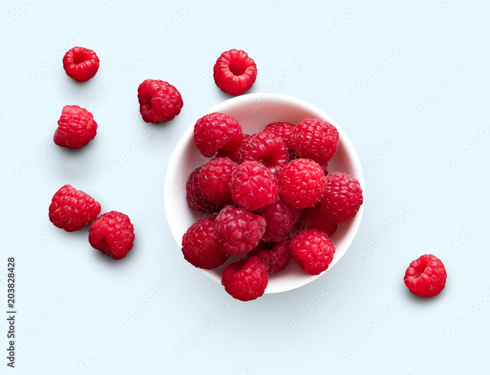 Bowl of raspberries isolated on white background Bowl of raspberries isolated on white background