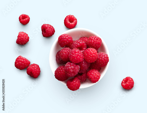 Bowl of raspberries isolated on white background