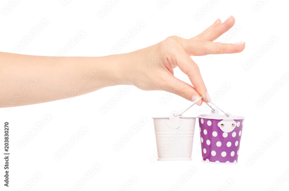 Fototapeta premium Small buckets in a hand