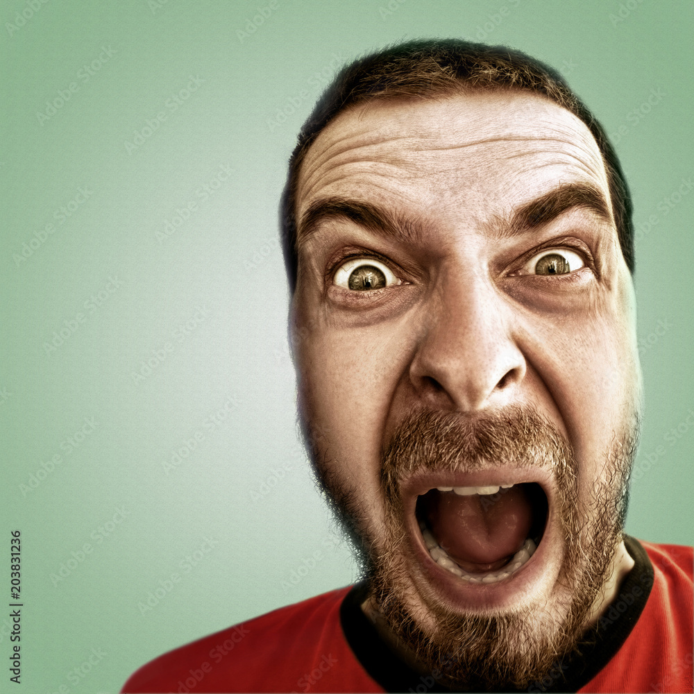Screaming face of shocked funny man Stock Photo | Adobe Stock