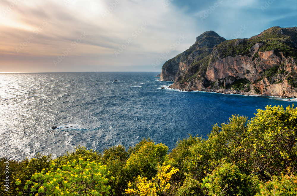 Beautiful seascape with cliffs and vivid green foliage from Paleokastritsa in Corfu, Greece. (HDR image)