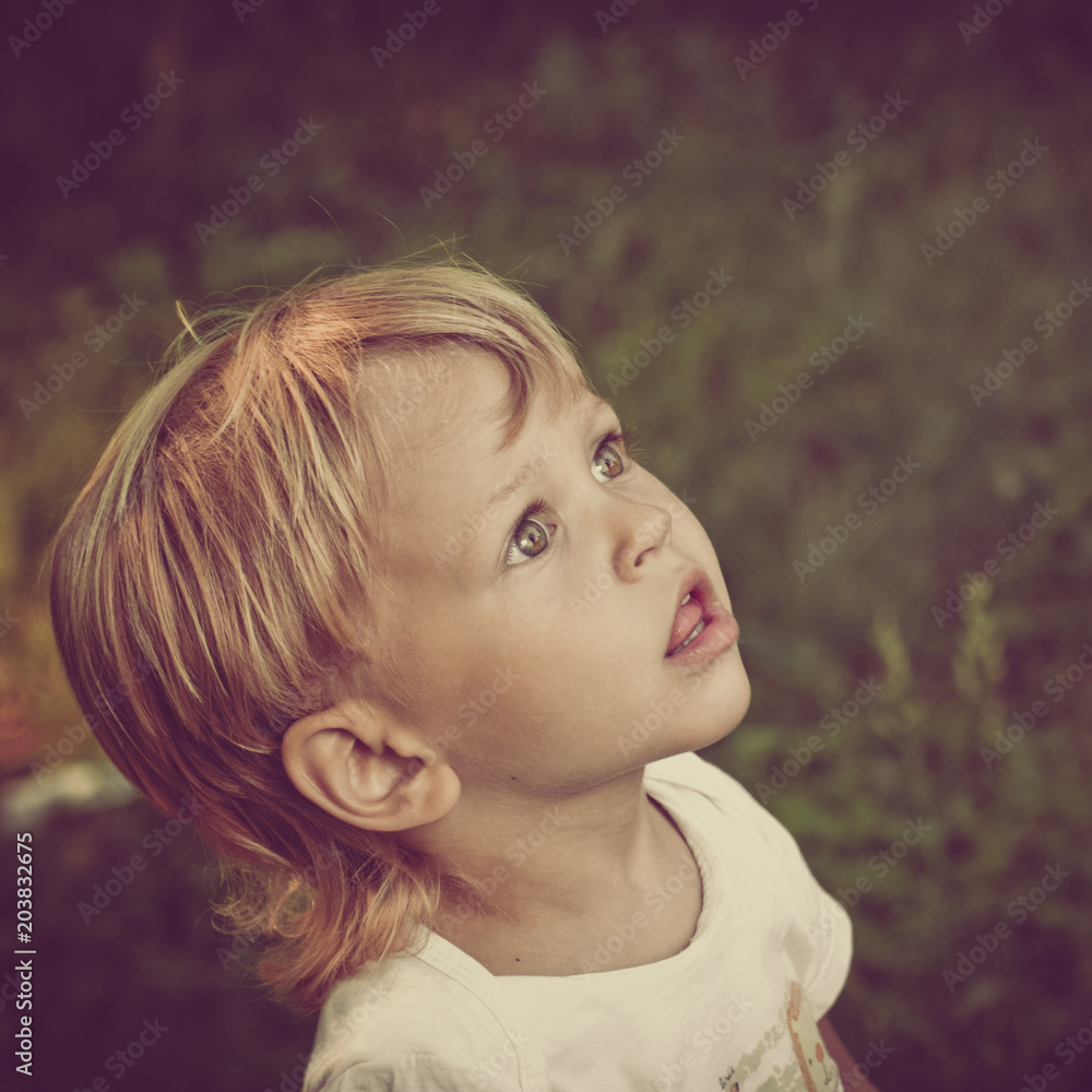 Portrait of excited funny little boy looking up Portrait of excited funny little boy looking up