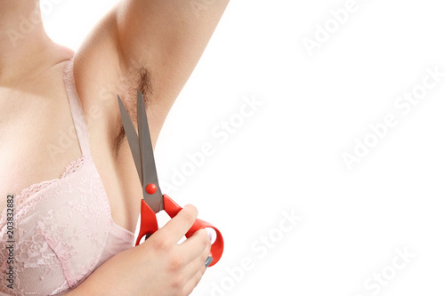 hairy armpit, isolated on white background, close-up, unshaven,  a lot of hair, scissors near the armpit, depilation with scissors