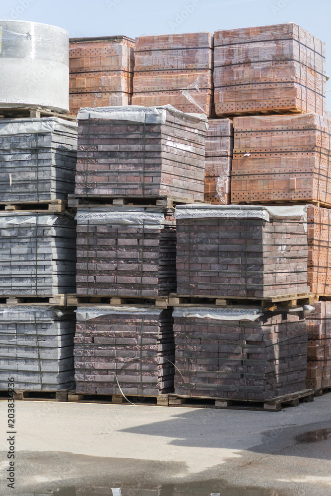 pallets with bricks in the building store. Racks with brick. Masonry, stonework. pallets with bricks in the building store. Racks with brick. Masonry, stonework.