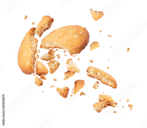 Foto Biscuits crumbles into pieces close-up isolated on a white background