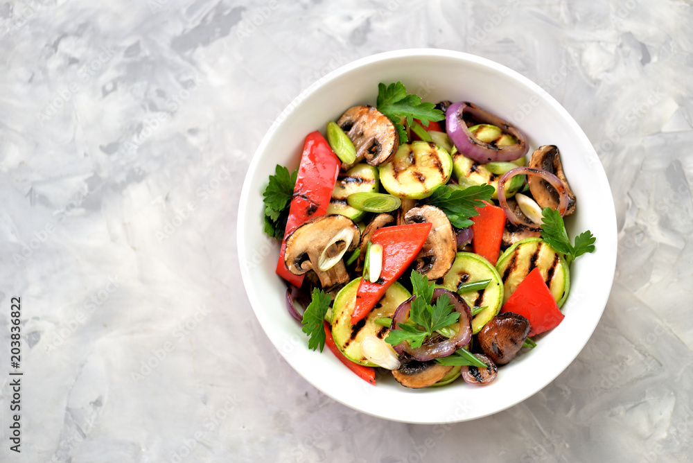 Grilled vegetables - zucchini, portobello mushrooms, red pepper, red onion, green onion, garlic, olive oil, wine vinegar, sea salt and parsley. Healthy food. Grilled vegetables - zucchini, portobello mushrooms, red pepper, red onion, green onion, garlic, olive oil, wine vinegar, sea salt and parsley. Healthy food.