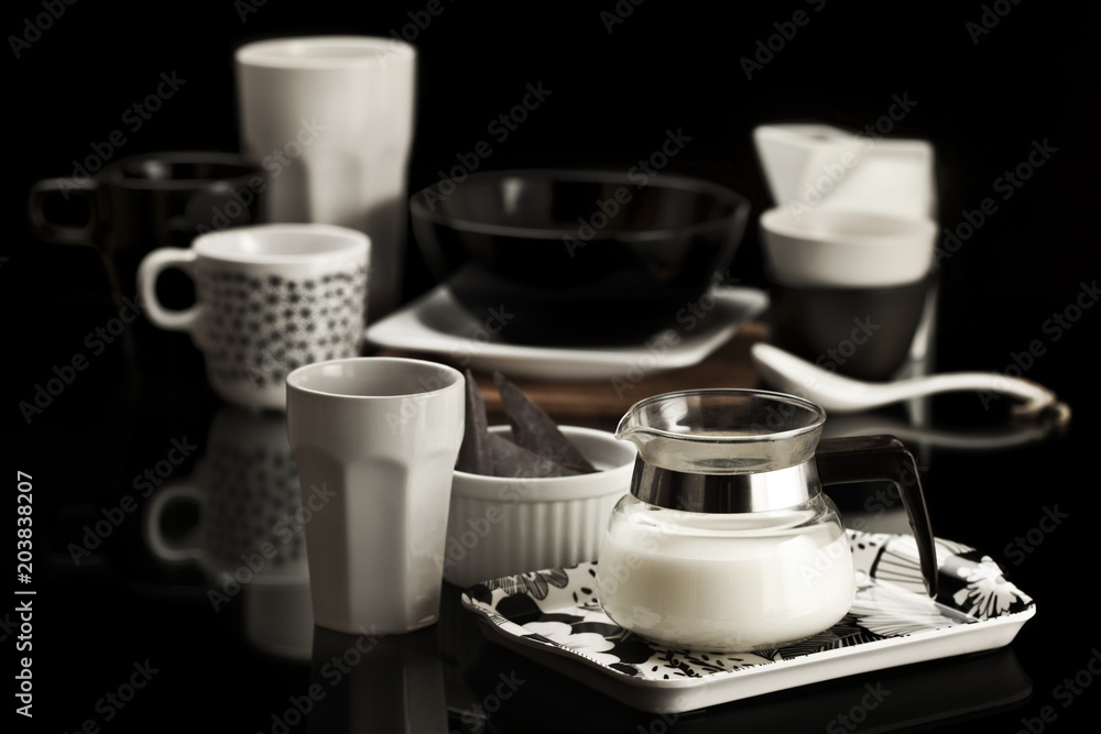 Fototapeta premium Table set with black and white dishware