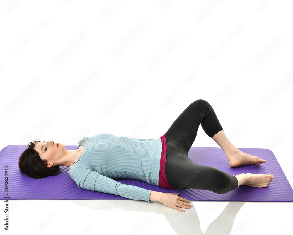 Mother woman exercising doing postnatal workout. Female fitness instructor stretching hands and legs in gym and work out exercises Mother woman exercising doing postnatal workout. Female fitness instructor stretching hands and legs in gym and work out exercises