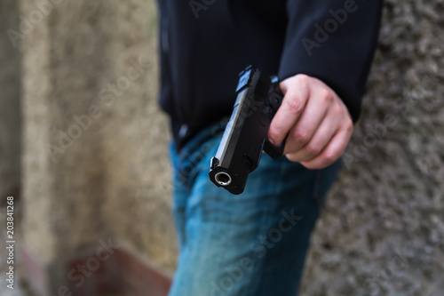 hand with a gun