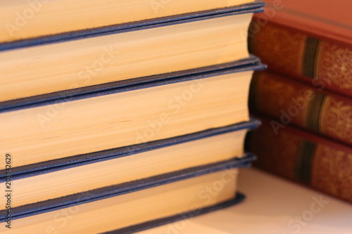 School supplies on the white background: vintage books. School and education. Colorful accessories: literature. Preparation for school. School supplies in focus. Books, reading.