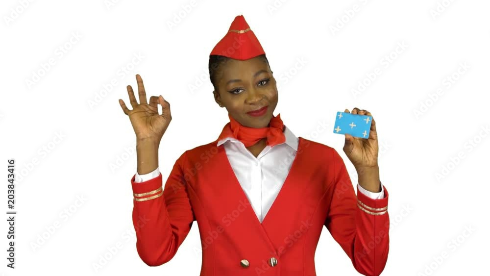 Afro american stewardess girl raises a card and shows a okey . Alpha channel Afro american stewardess girl raises a card and shows a okey . Alpha channel