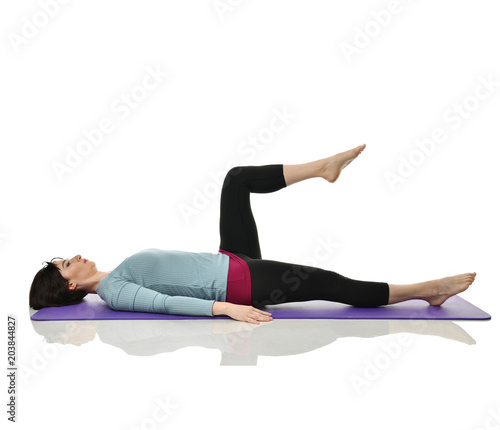 Mother woman exercising doing postnatal workout. Female fitness instructor stretching hands and legs in gym and work out exercises