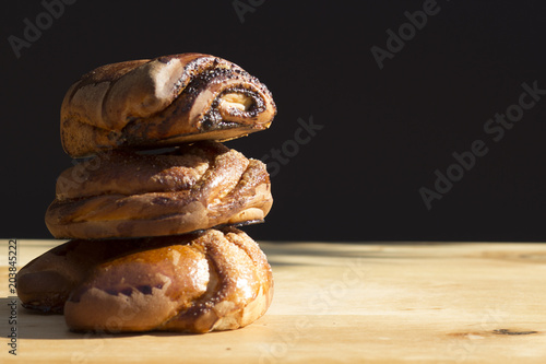 three buns on a wooden background