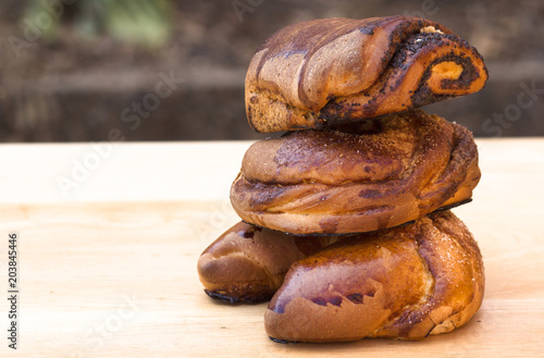 three buns on a wooden background
