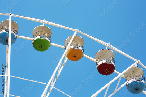 Colorful ferris wheel on blue sky background in Luna Park. photo