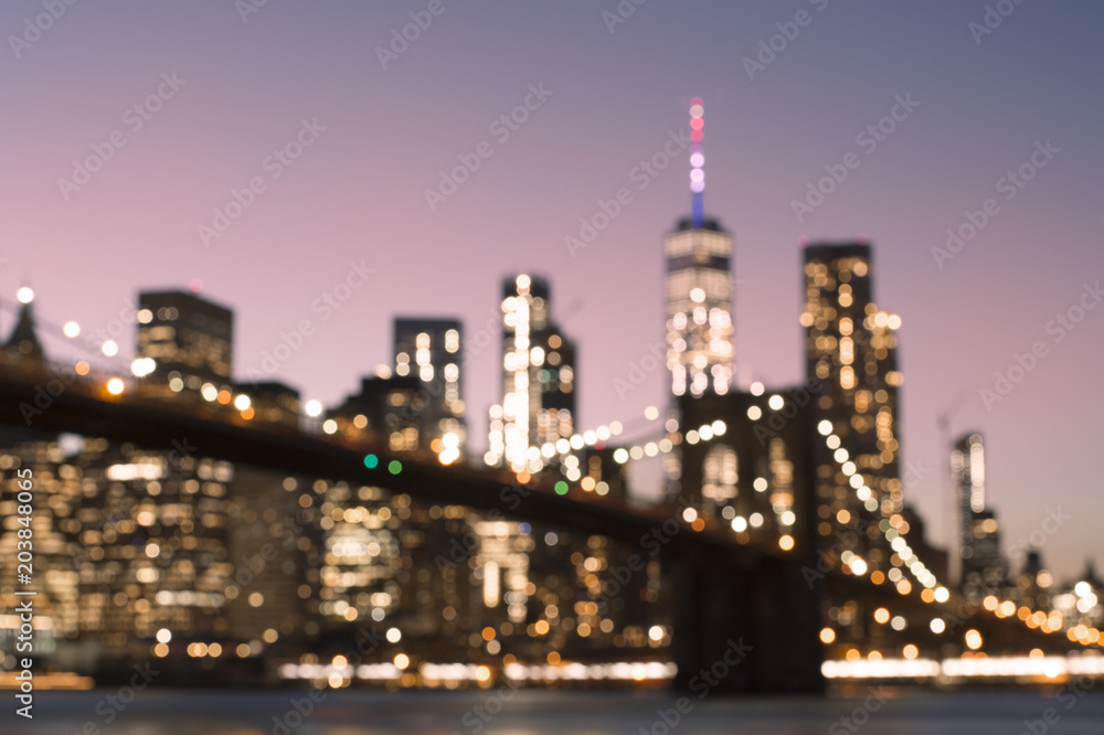 Blurred view of illuminated Manhattan skyline during the sunset. New York City, USA. Blurred view of illuminated Manhattan skyline during the sunset. New York City, USA.