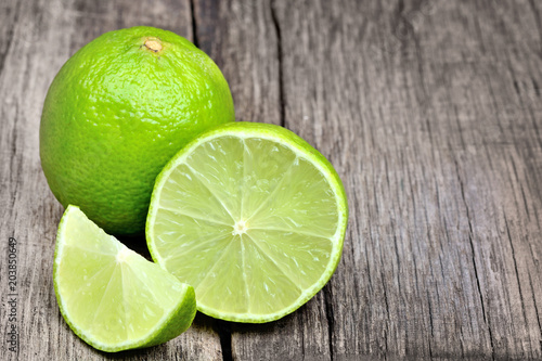 Lime on rustic wood board background