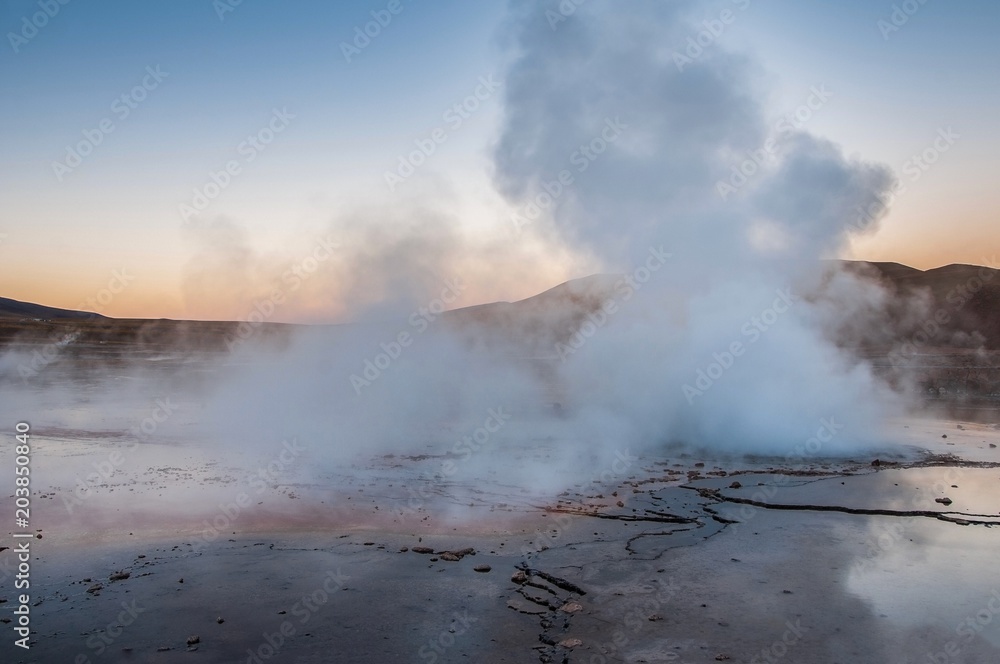 Steam coming out of geysers during sunrise at Tatio Geysers, Atacama desert, northern Chile.