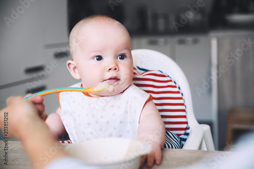 Feeding. Baby's first solid food