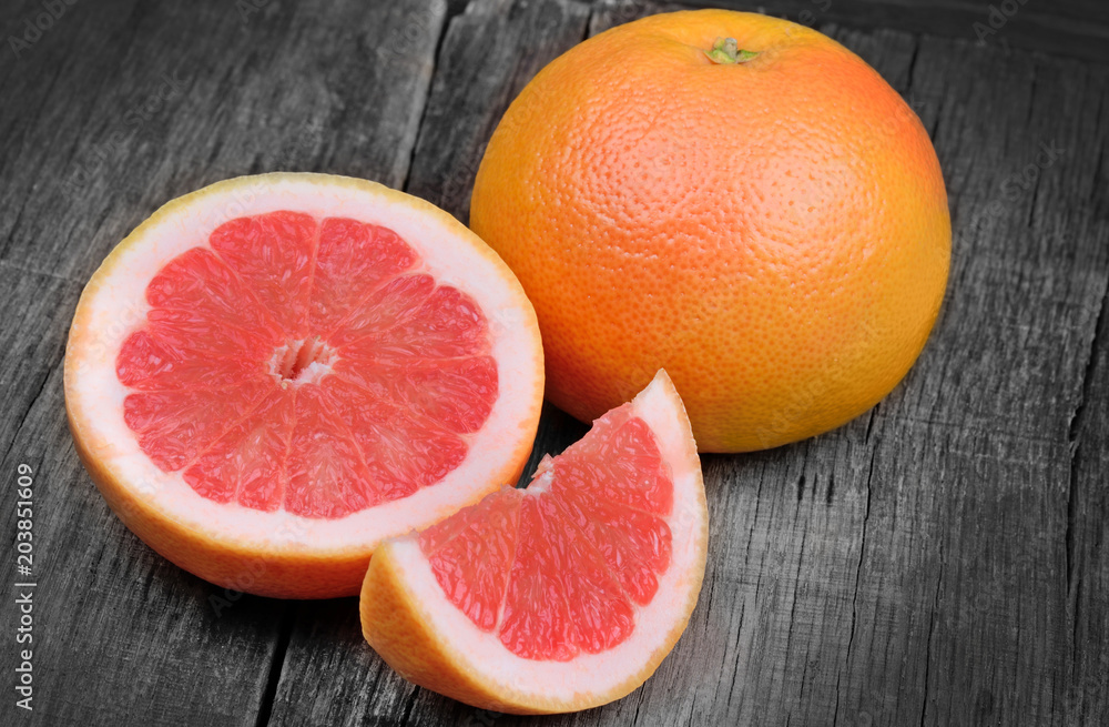 Red grapefruit on old table Red grapefruit on old table
