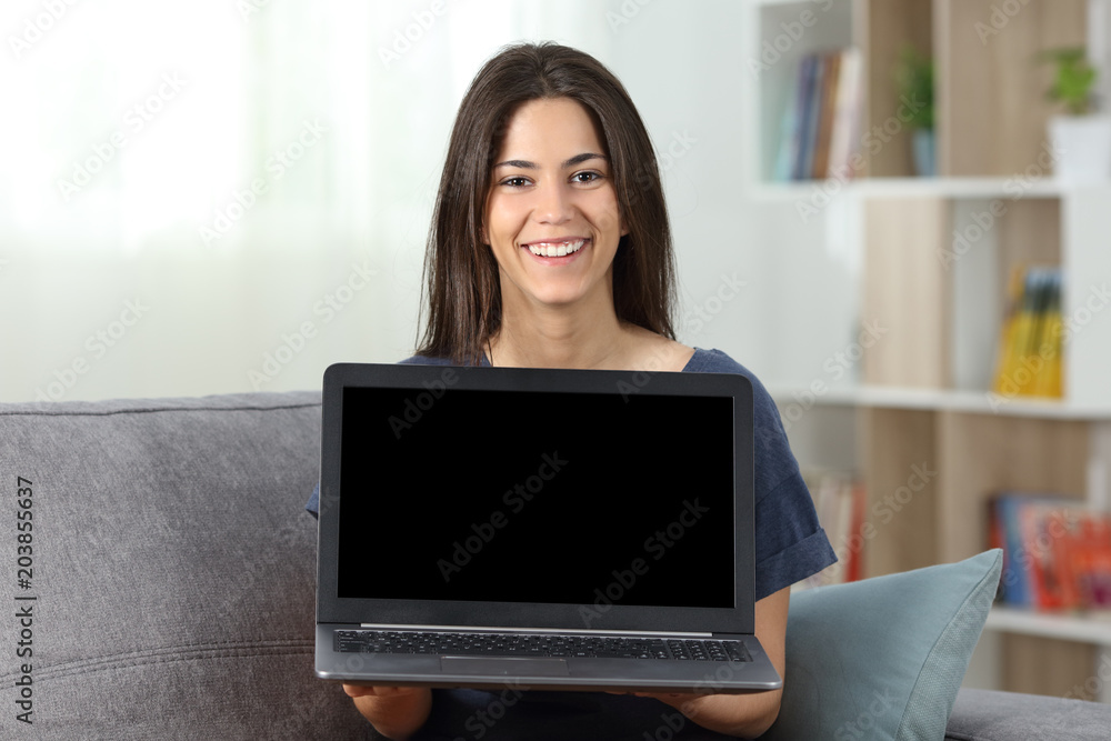 Fototapeta premium Teen showing a blank laptop screen mockup