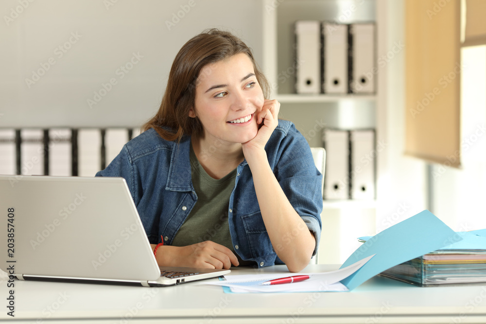 Intern dreaming looking at side at office Intern dreaming looking at side at office