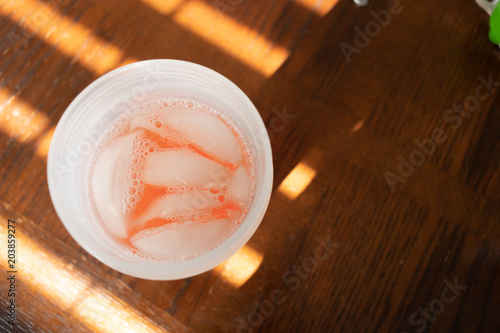 Cold Iced Tea Served as refreshment on bright sunny day  photo