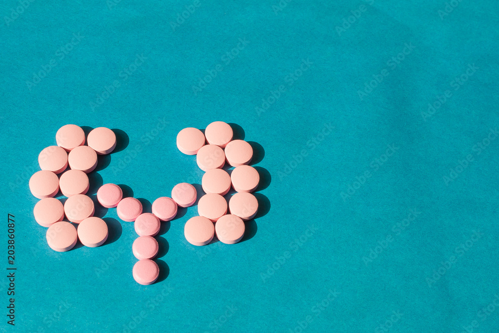 on a blue background from tablets the form of human kidneys is laid out. The concept of a cure for the kidneys on a blue background from tablets the form of human kidneys is laid out. The concept of a cure for the kidneys