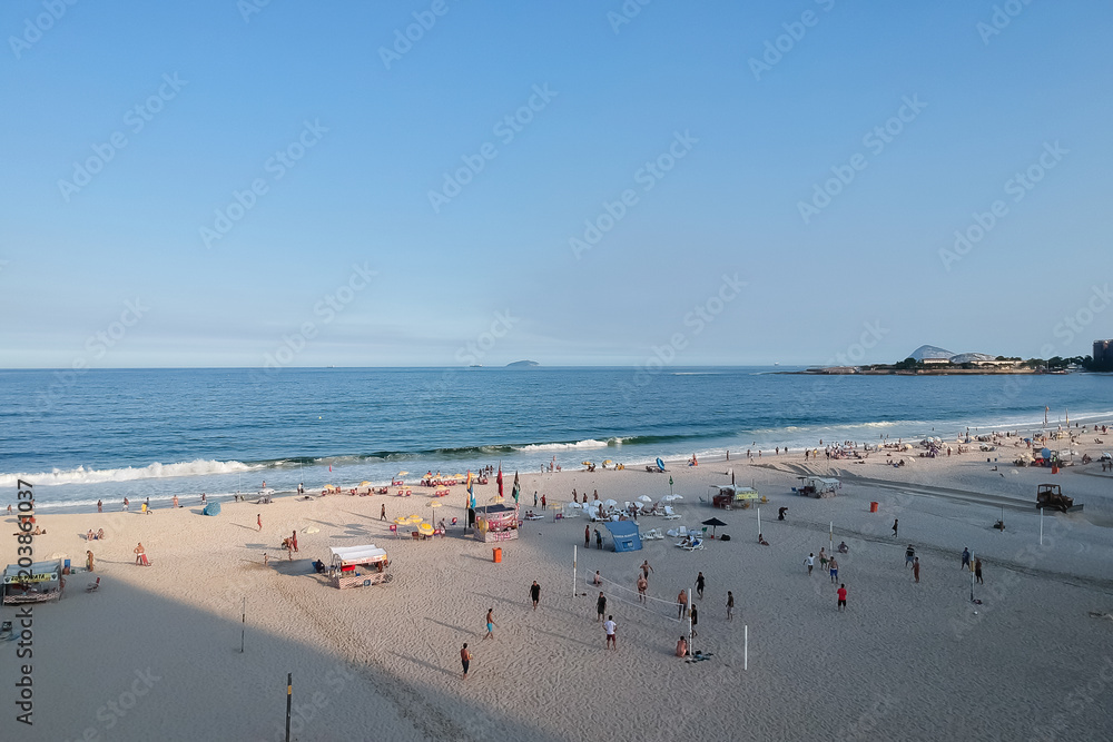 aerial drone view of Copacabana beachs during late afternoon,, some shadows can be seen on the sand. Rio de Janeiro, Brazil