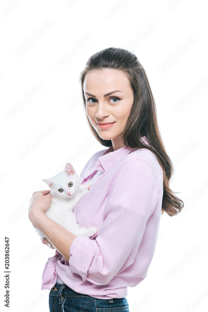 young woman holding kitten in hands isolated on white background