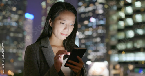 Photography Young Business woman use of cellphone at night